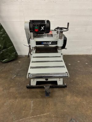Used Delta X5 3hp 15" planer with straight knife cutterhead, stand with folding tables and mobile base