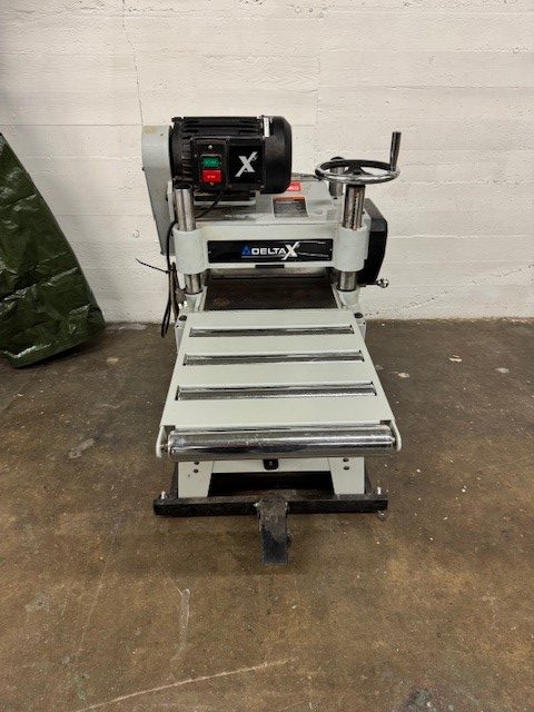 Used Delta X5 3hp 15" planer with straight knife cutterhead, stand with folding tables and mobile base