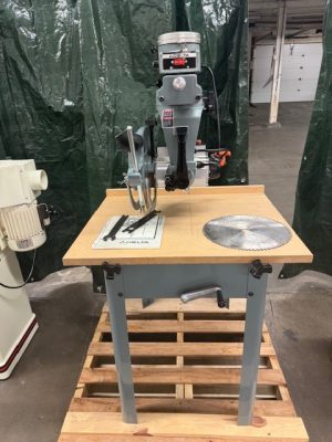 Used Delta 33-890 12" radial arm saw with stand and (2) Forrest Chopmaster blades
